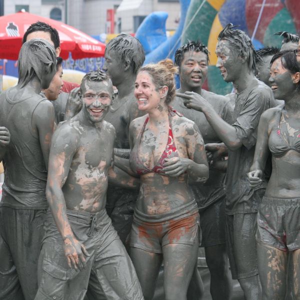 Muddy people at the Boryeong Mud Festival