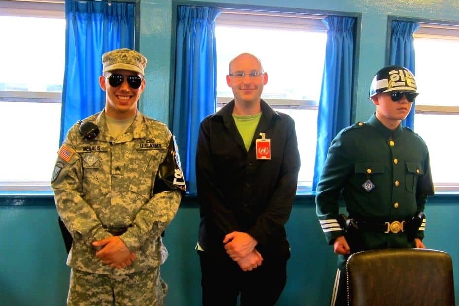 Joel at Panmunjom Peace Village with North Korean and South Korean guards