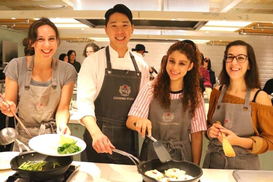 People learning to cook traditional Korean dishes in Seoul