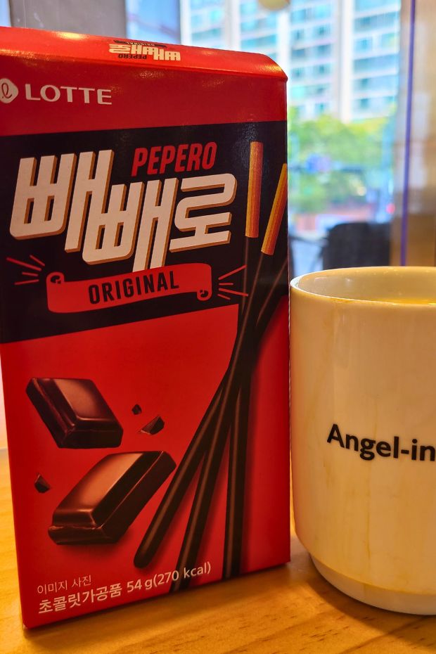 Box of Pepero with a cup of coffee