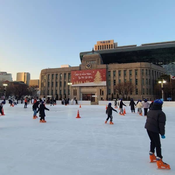 Where Does It Snow In Korea? Snow In Seoul And Korea 2025 17 People ice skating outside City Hall in Seoul