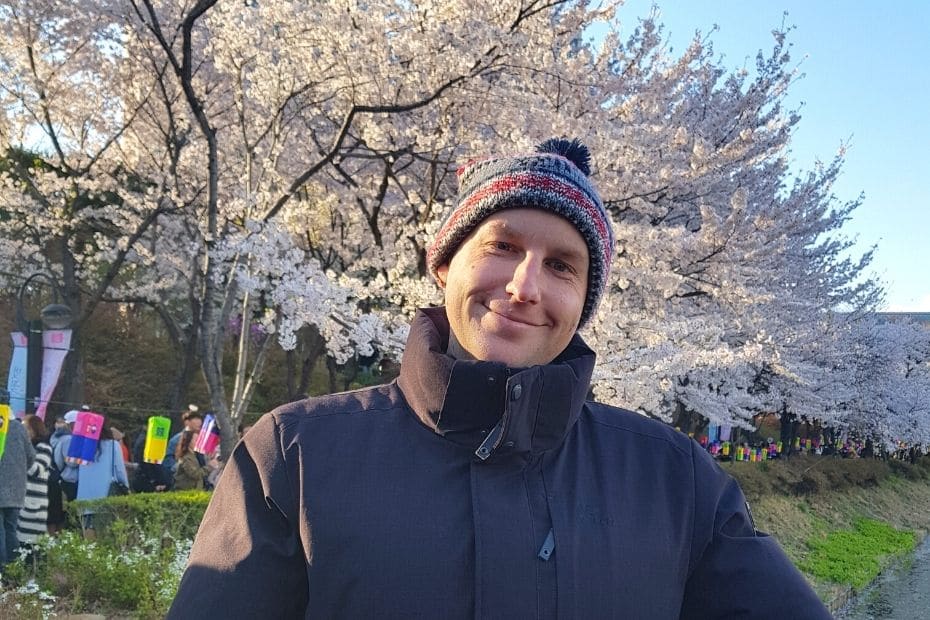 Joel with cherry blossoms in Seokchon Lake, Seoul, Korea