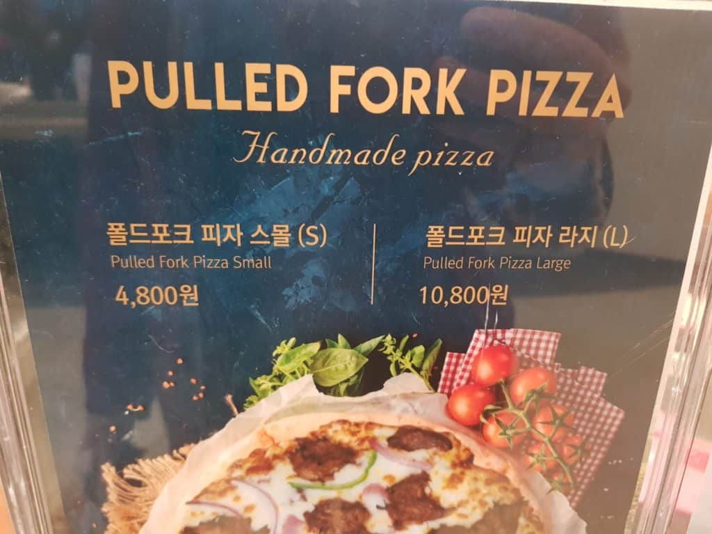 Funny Korean sign showing pulled fork pizza