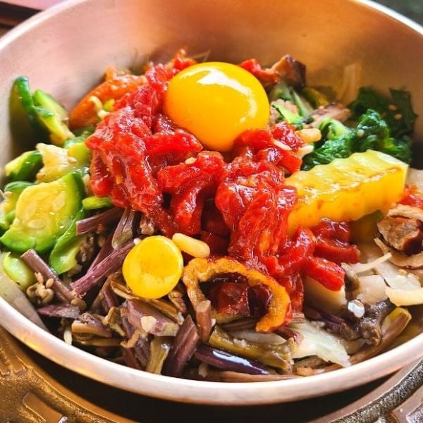 Yukhoe raw beef in a bowl of bibimbap