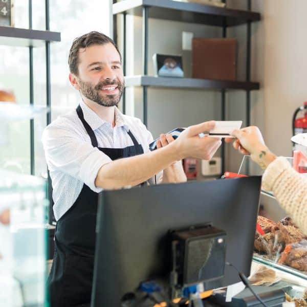 Giving a T-Money card to a cashier