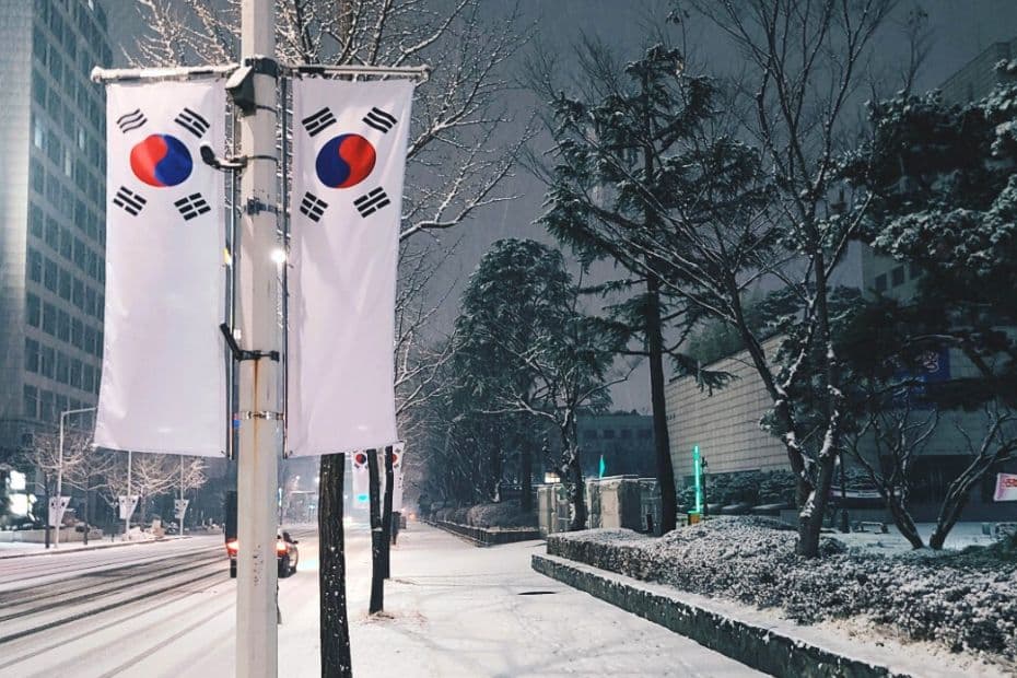 Street in Korea in winter with Korean flags