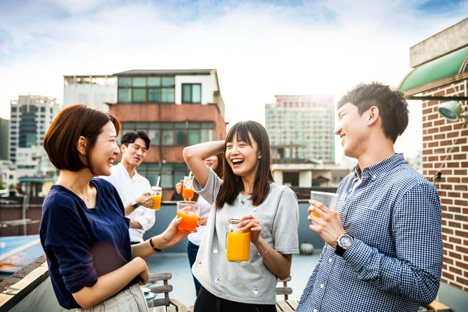 Korean people drinking on a rooftop
