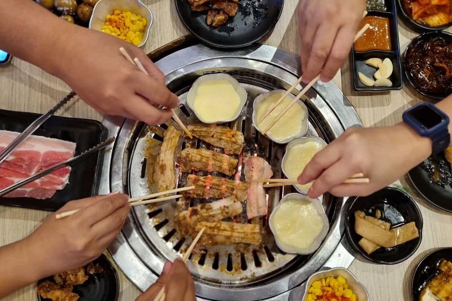 People sharing a Korean meal together