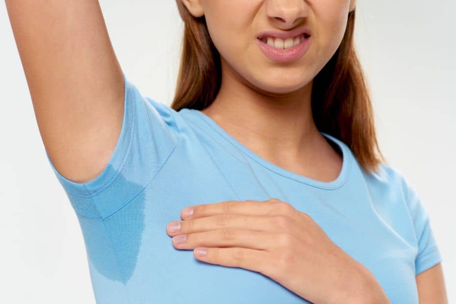 Woman with sweaty armpits