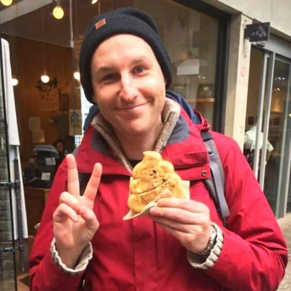 Man holding a poop bread in Seoul