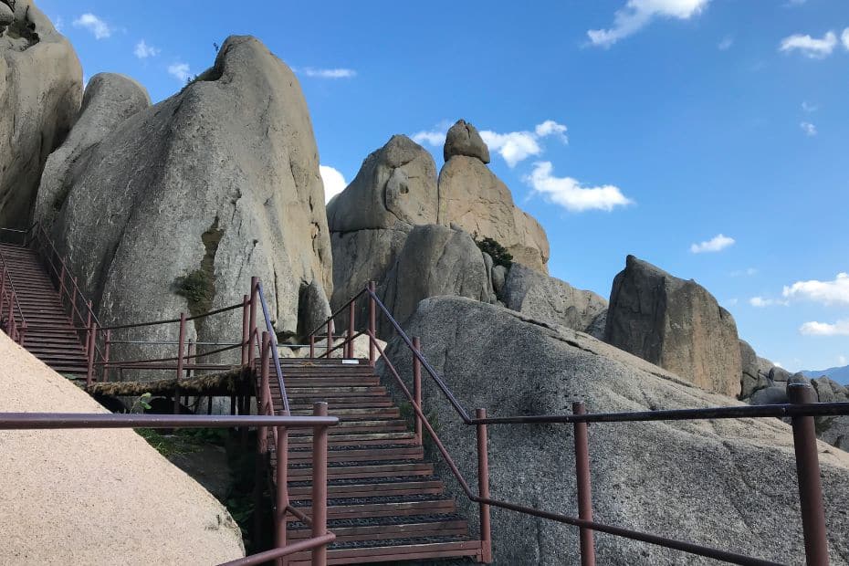 Hiking staircase among rocky peaks