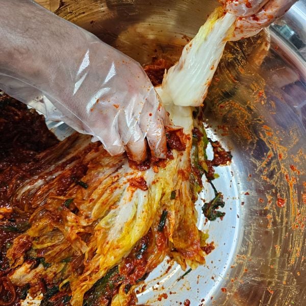 Making kimchi by hand during gimjang