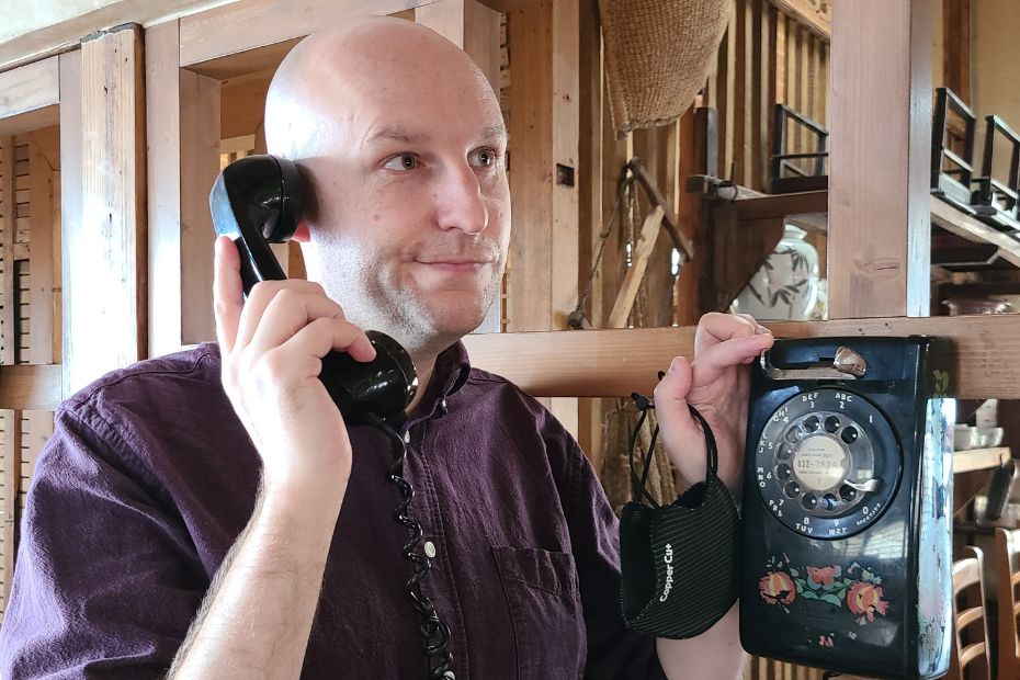 Man using an old fashioned phone in Korea