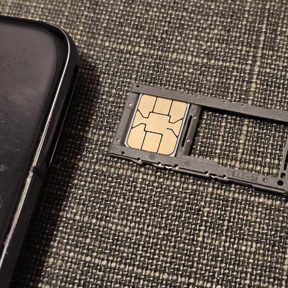 SK SIM Card being inserted into phone