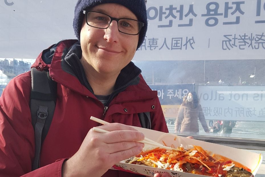 Eating trout at Hwacheon Sancheoneo Ice Festival
