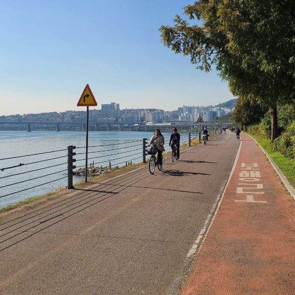 People riding by the Han River in Seoul